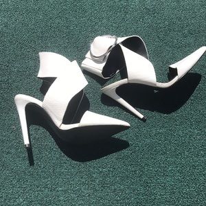 White heels with wide ankle wrap with adjustable buckle